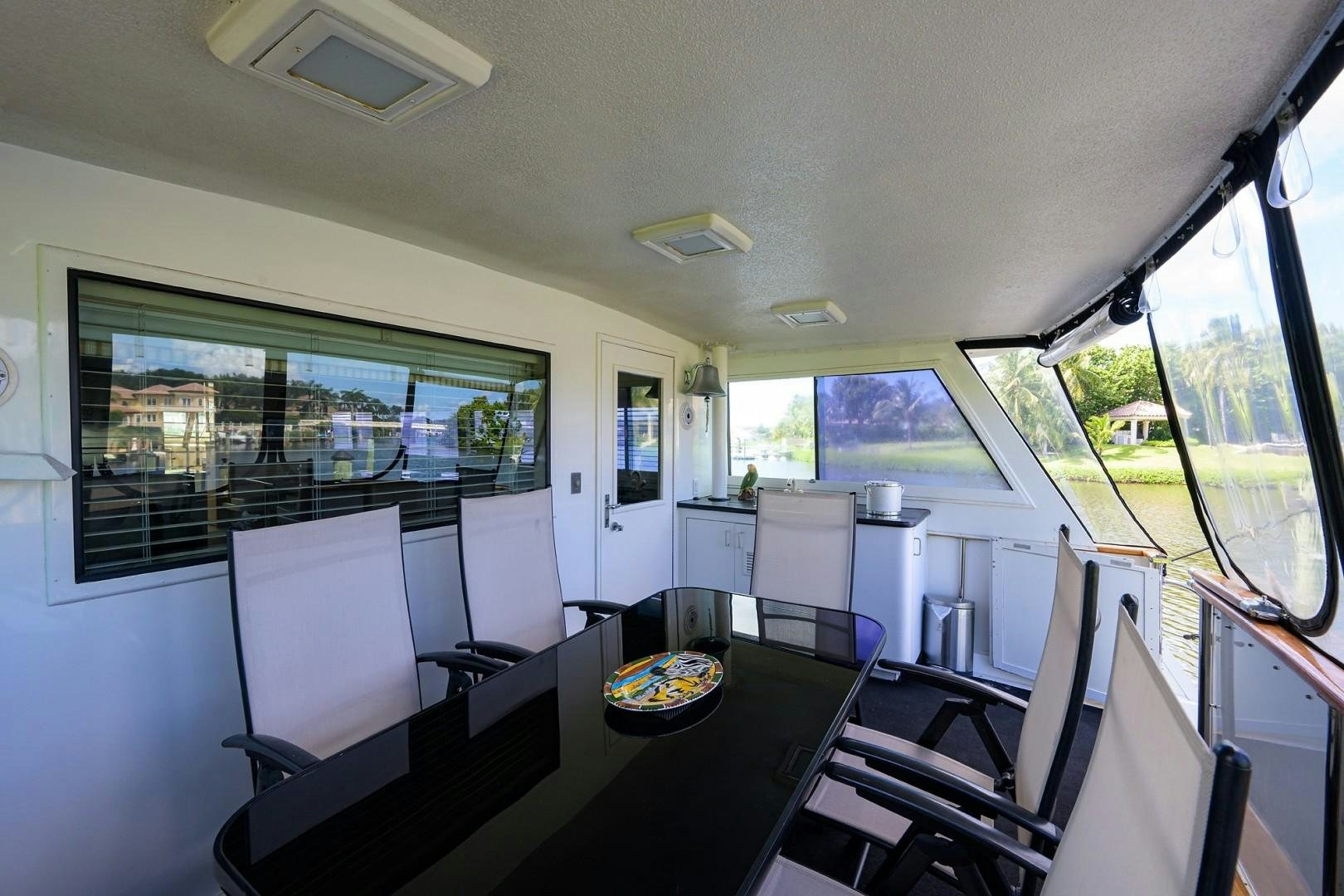 a room with a table and chairs aboard GYPSY ROSE Yacht for Sale