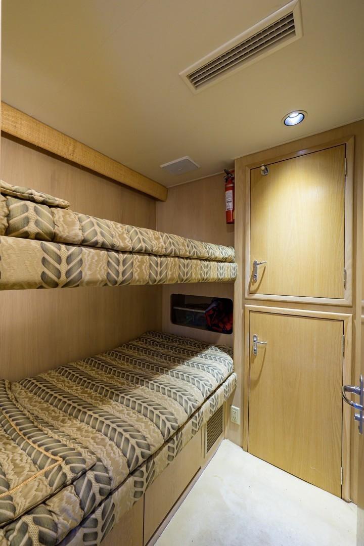 a room with a bed and a closet aboard GYPSY ROSE Yacht for Sale