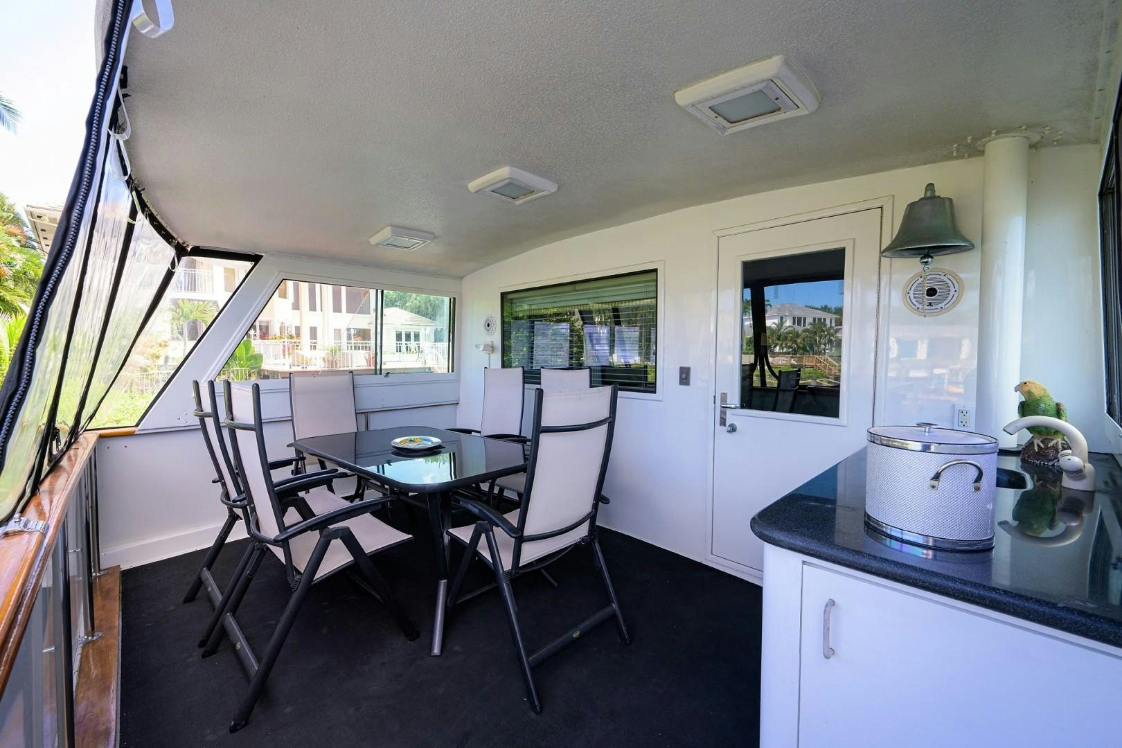 a kitchen with a table and chairs aboard GYPSY ROSE Yacht for Sale
