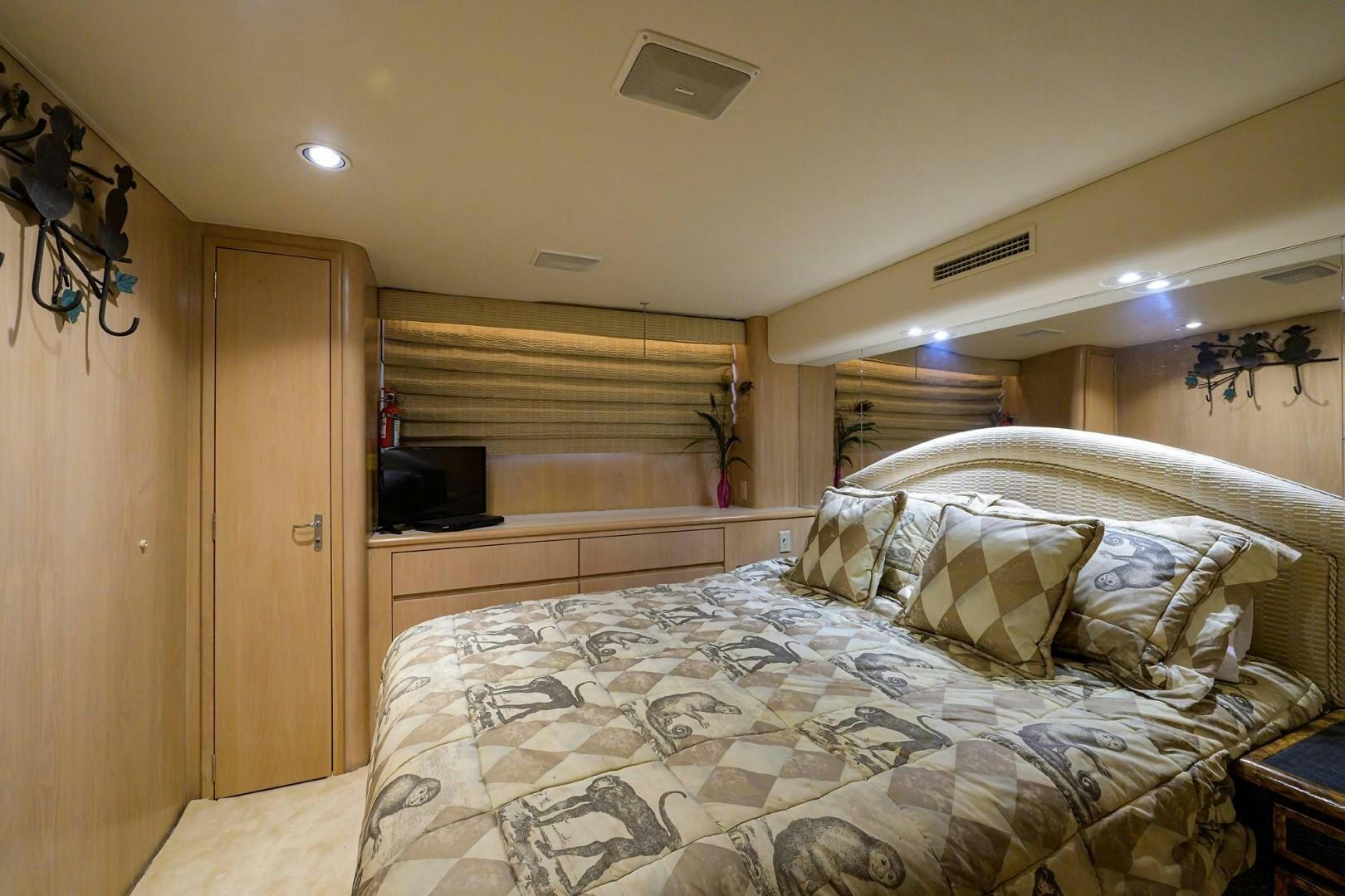 a bed with a white comforter aboard GYPSY ROSE Yacht for Sale