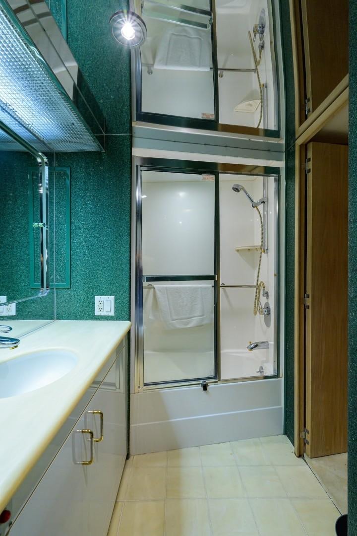 a bathroom with a glass shower aboard GYPSY ROSE Yacht for Sale