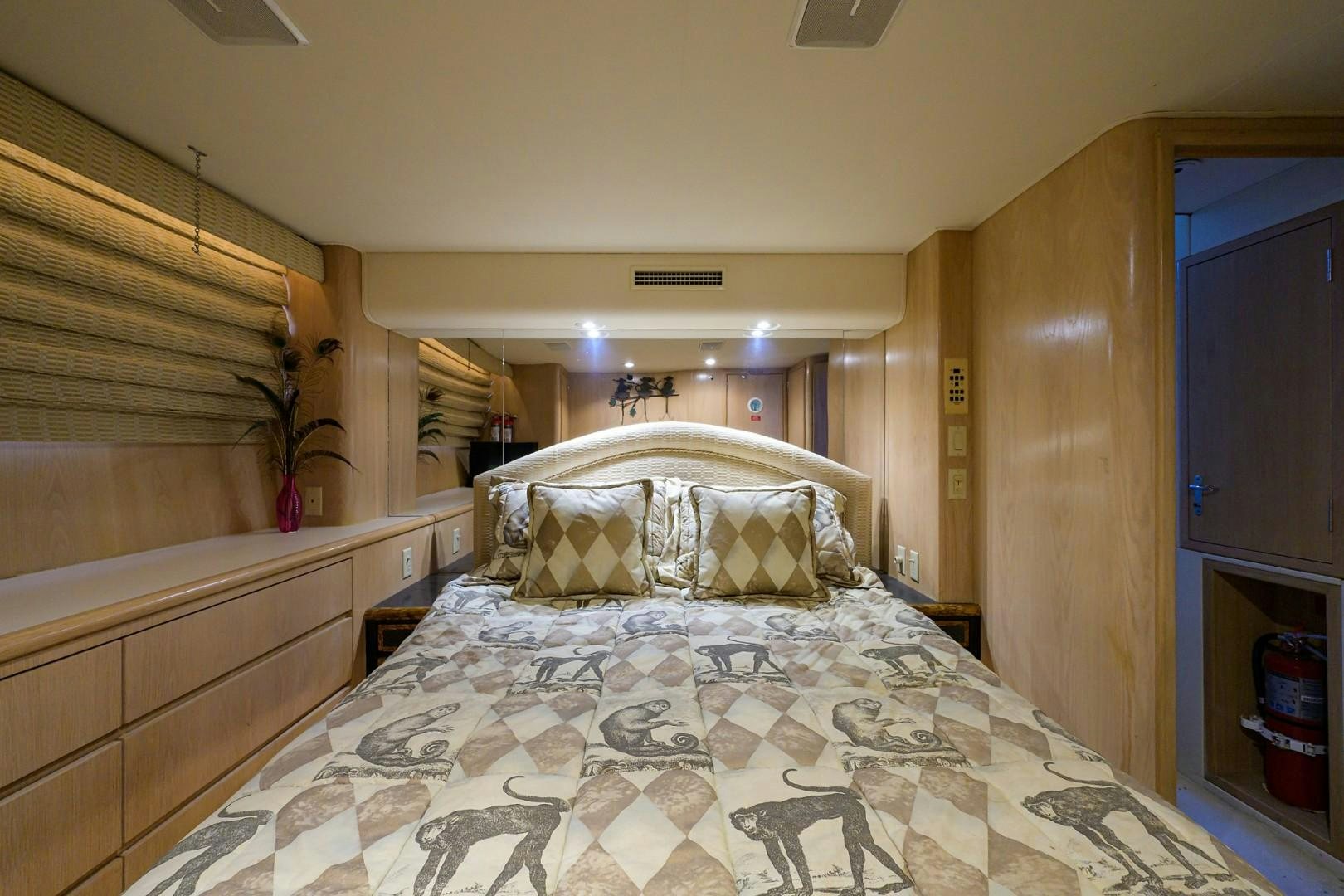 a bed with a large headboard aboard GYPSY ROSE Yacht for Sale