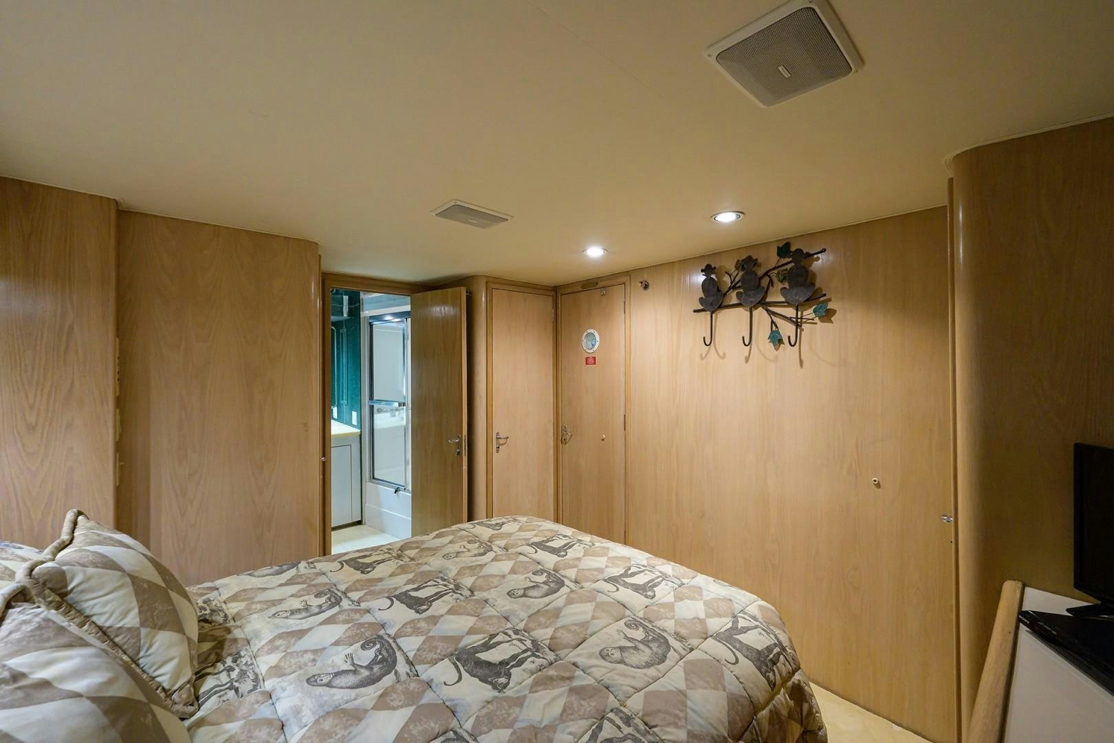 a bedroom with a bed aboard GYPSY ROSE Yacht for Sale