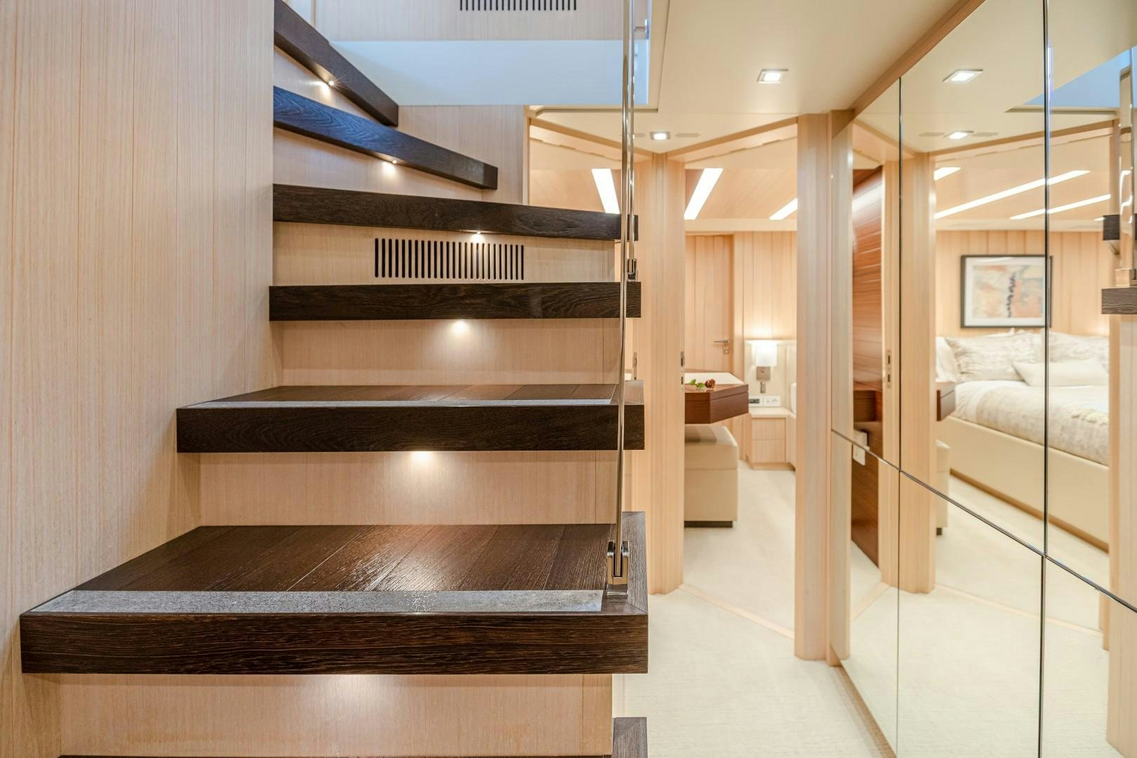 a room with a wood staircase aboard DYLAN ANNE Yacht for Sale