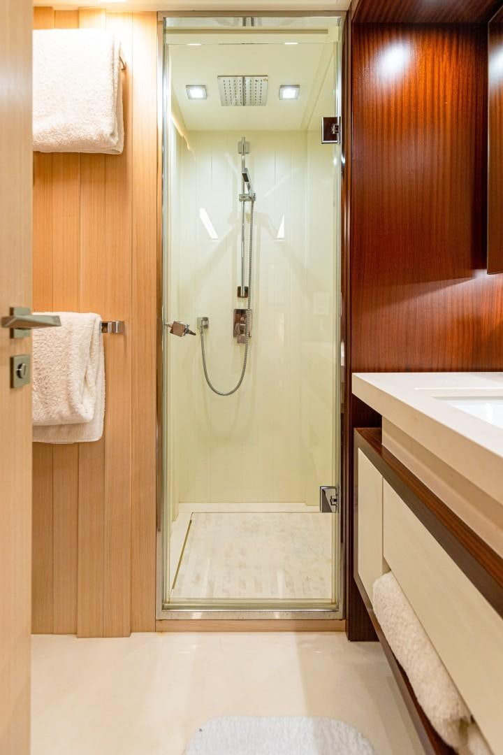 a bathroom with a shower and sink aboard DYLAN ANNE Yacht for Sale
