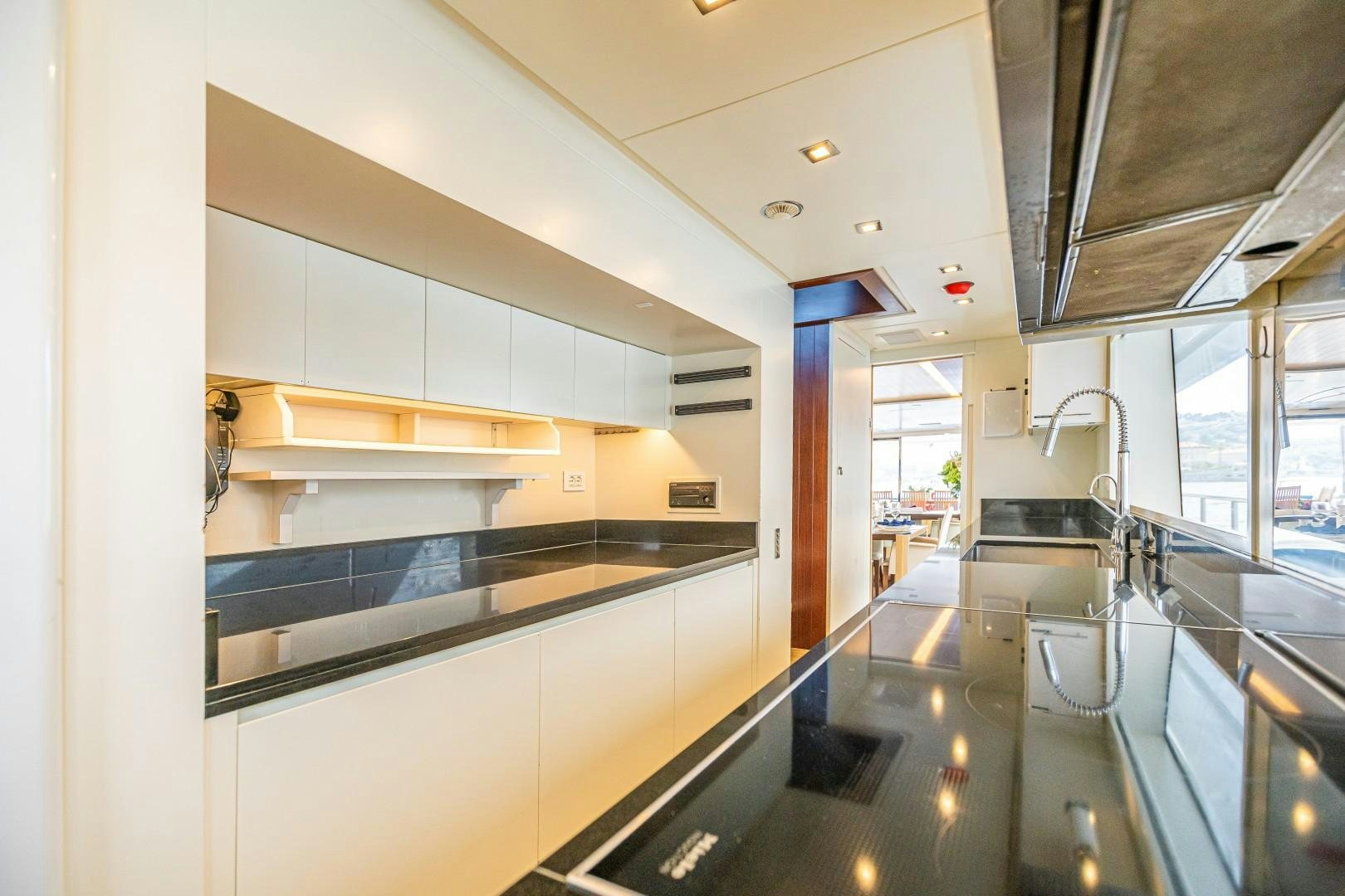a kitchen with a large island aboard DYLAN ANNE Yacht for Sale