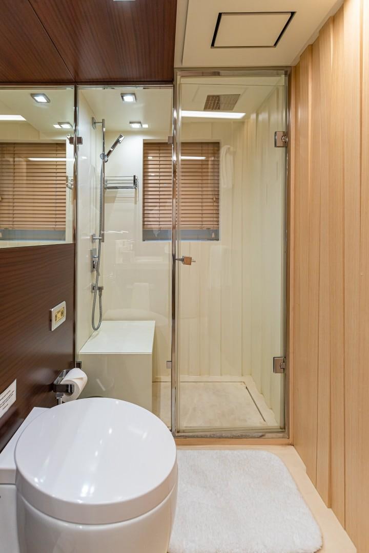 a bathroom with a glass shower aboard DYLAN ANNE Yacht for Sale