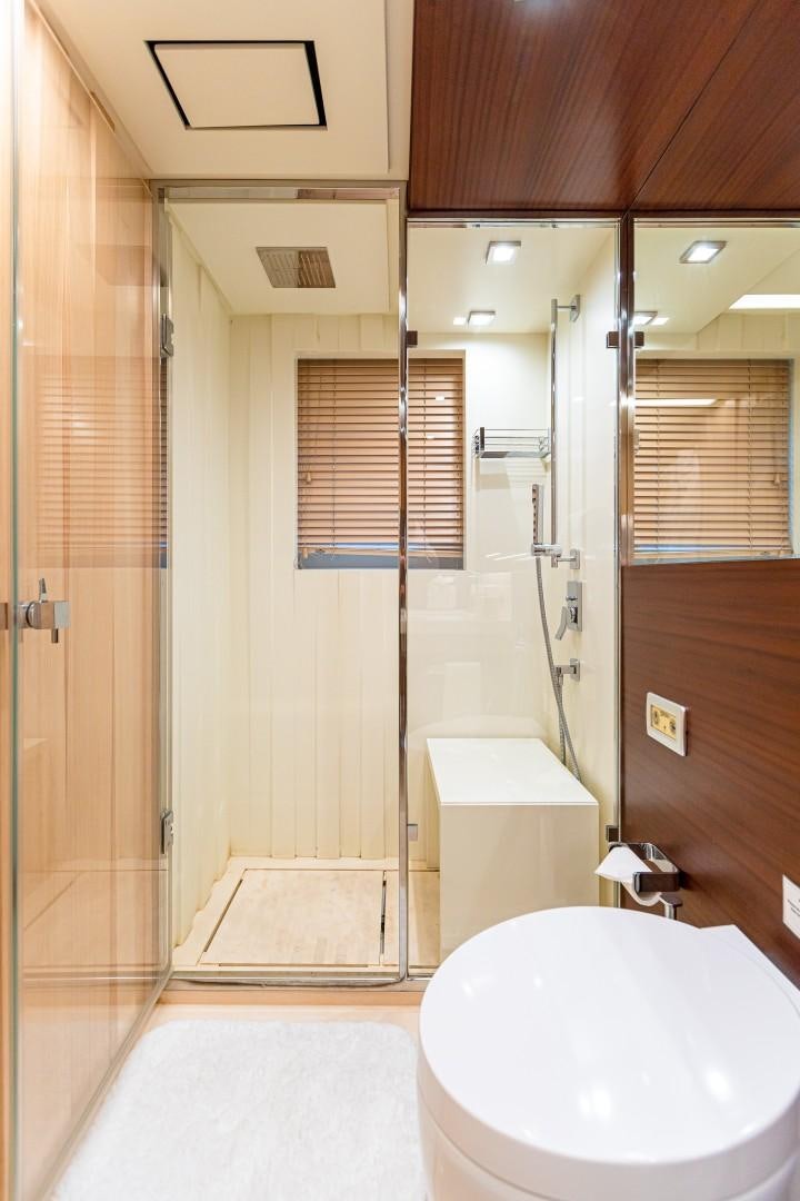 a bathroom with a glass shower aboard DYLAN ANNE Yacht for Sale