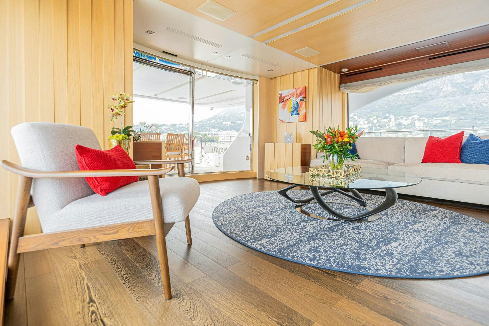 a living room with a large window aboard DYLAN ANNE Yacht for Sale