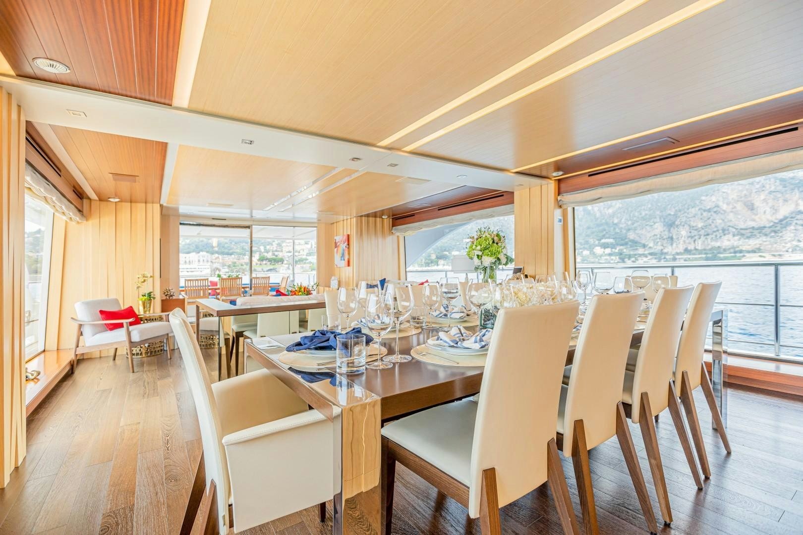 a dining room with a large window aboard DYLAN ANNE Yacht for Sale