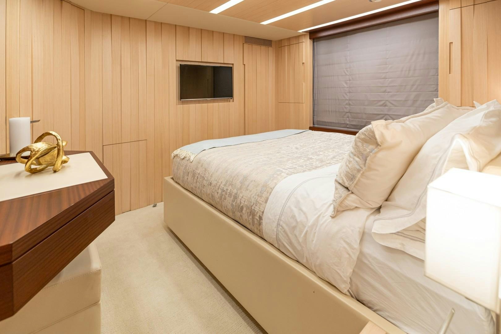 a bedroom with a bed and a dresser aboard DYLAN ANNE Yacht for Sale