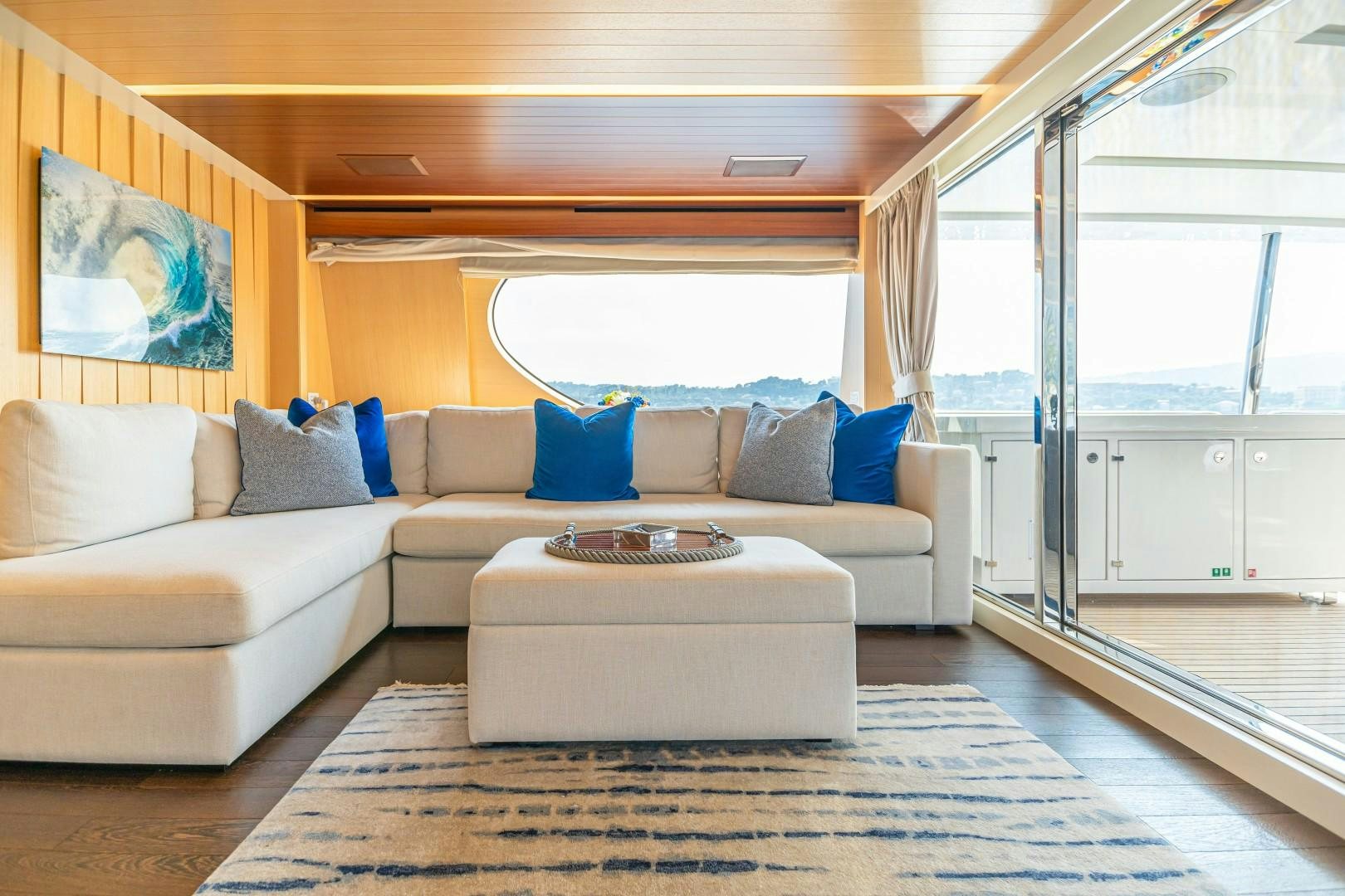 a living room with a couch and a table aboard DYLAN ANNE Yacht for Sale