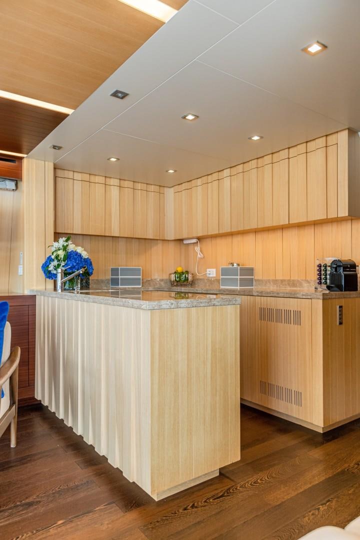 a kitchen with wooden cabinets aboard DYLAN ANNE Yacht for Sale