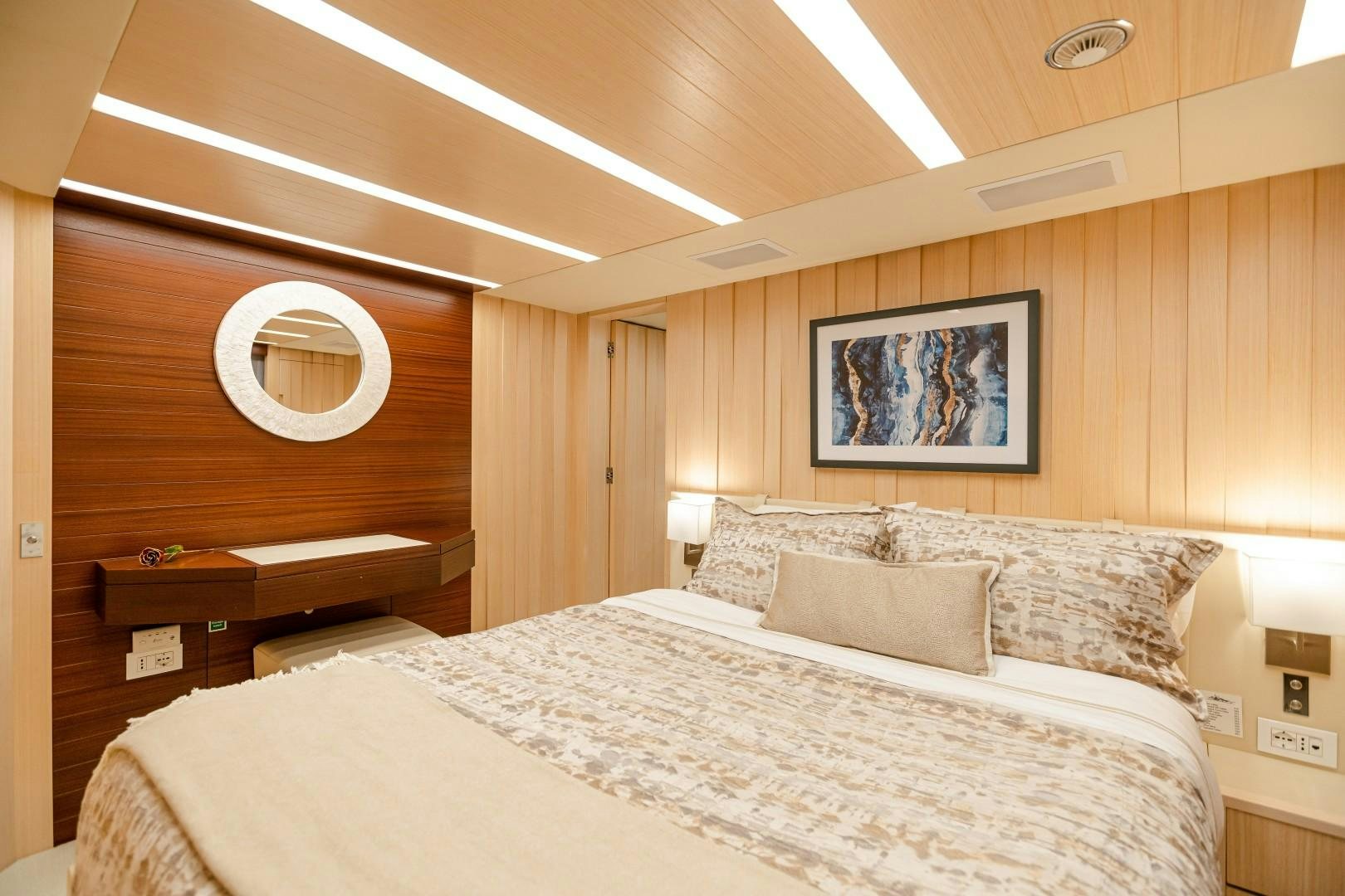 a bed with a white bed spread aboard DYLAN ANNE Yacht for Sale