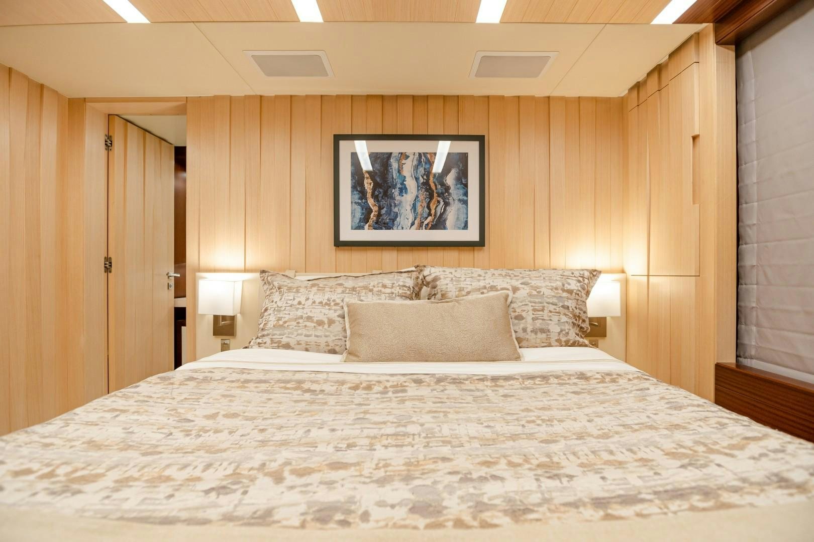 a bed with a white comforter aboard DYLAN ANNE Yacht for Sale