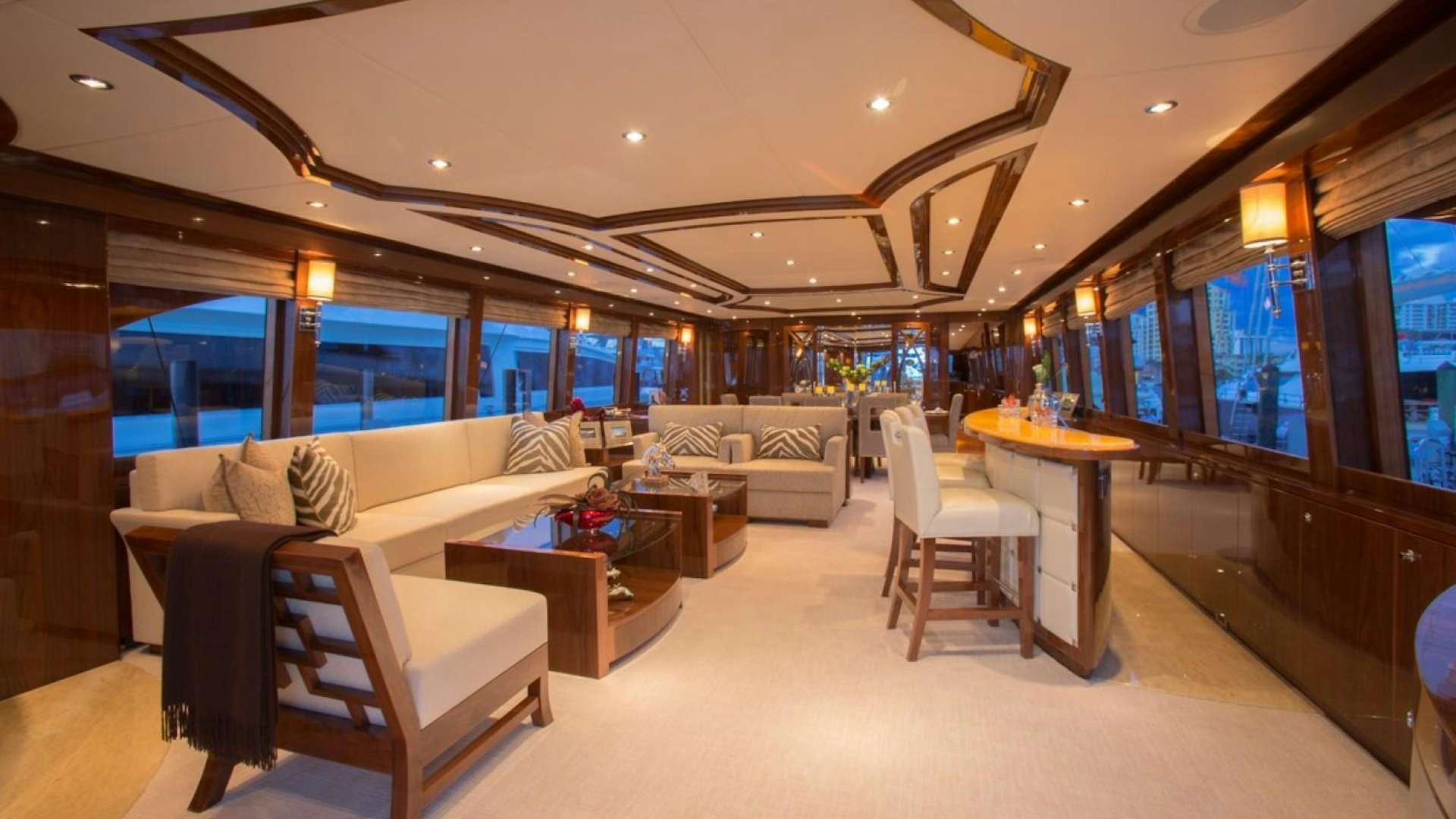 a room with couches and a table aboard CARBON COPY Yacht for Sale