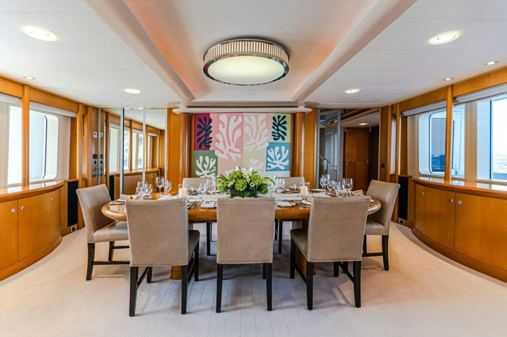 a large kitchen with a table and chairs aboard TASIA Yacht for Sale