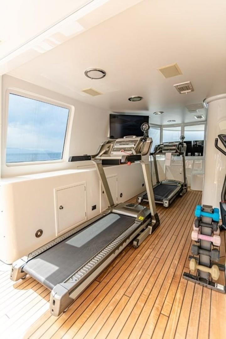 a room with a machine aboard TASIA Yacht for Sale