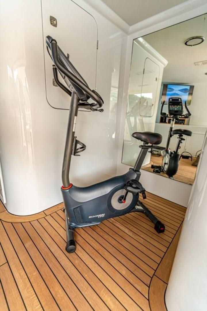 a vacuum cleaner in a room aboard TASIA Yacht for Sale