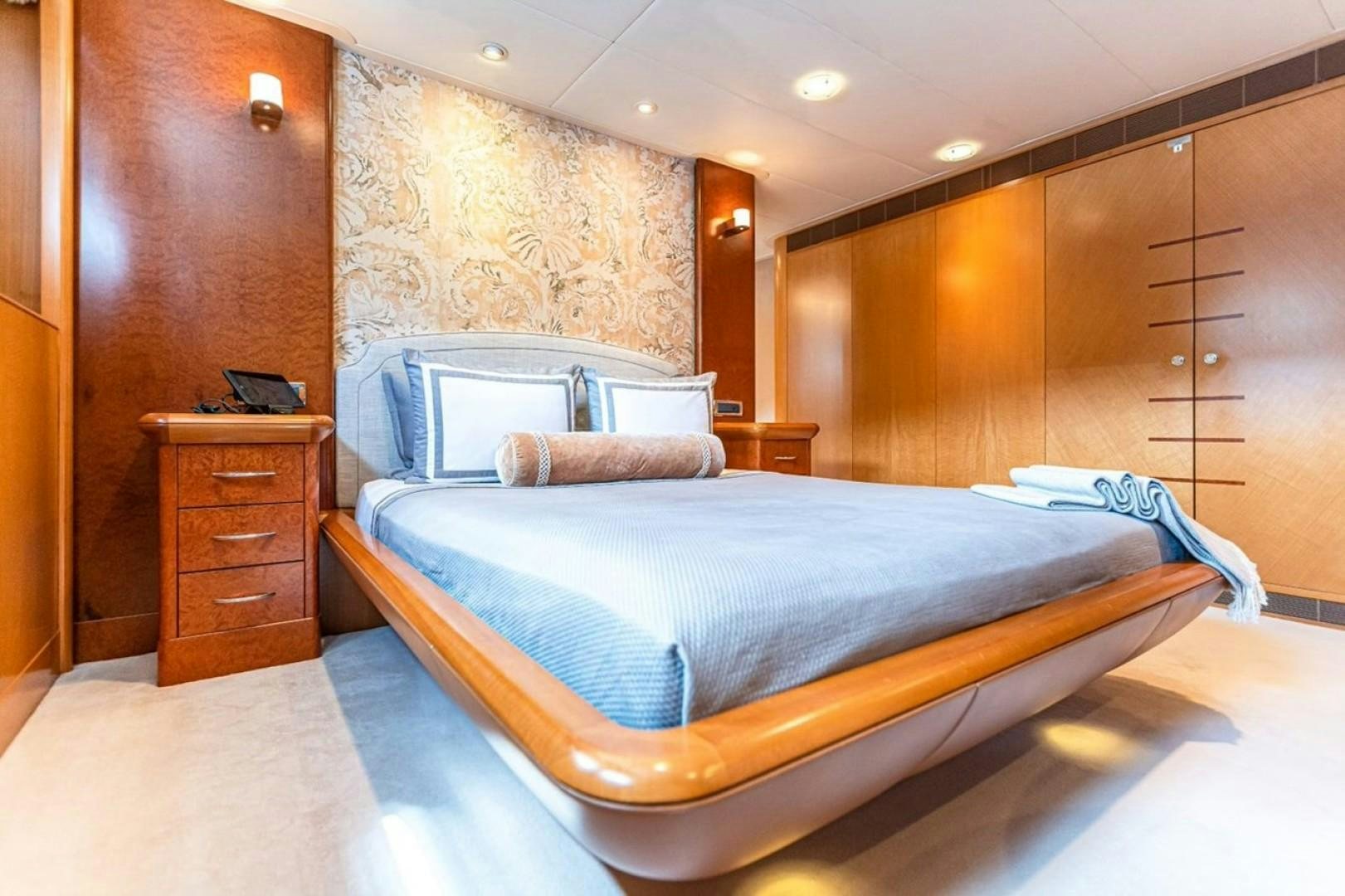a bed in a room aboard TASIA Yacht for Sale