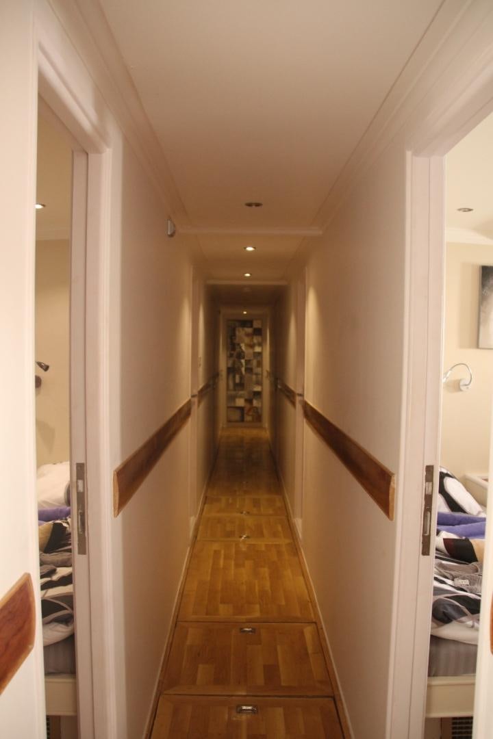 a hallway with a wood floor aboard SIM SIM Yacht for Sale