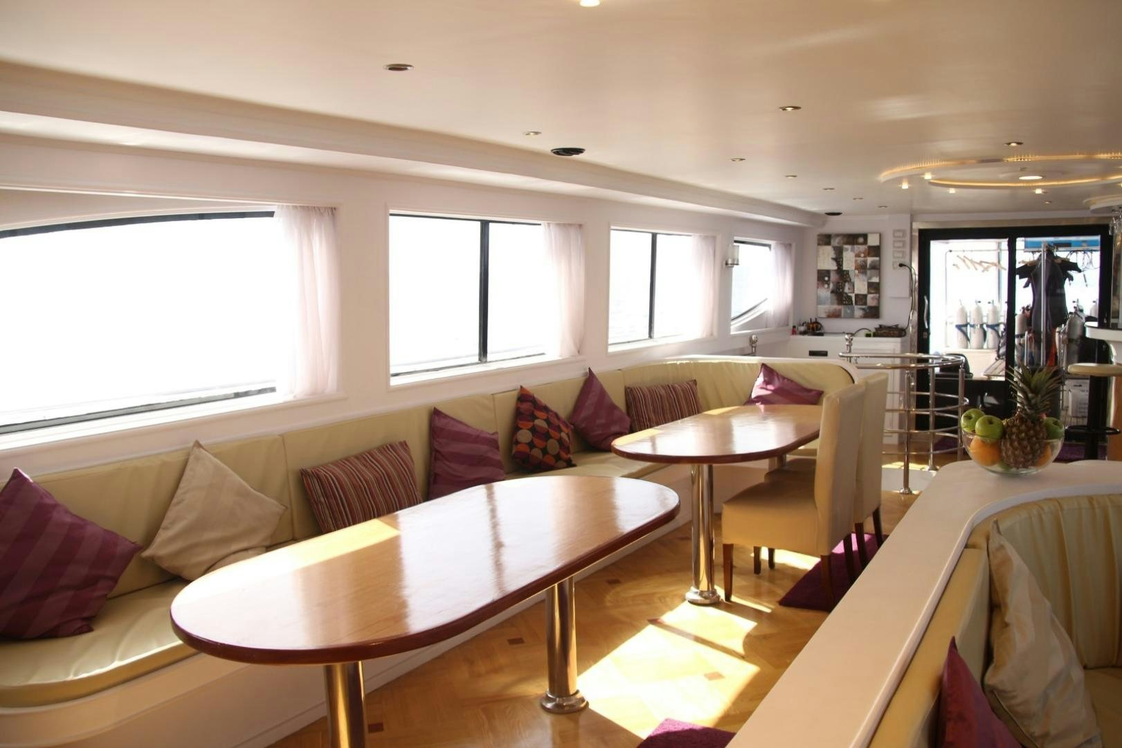 a room with a table and chairs aboard SIM SIM Yacht for Sale