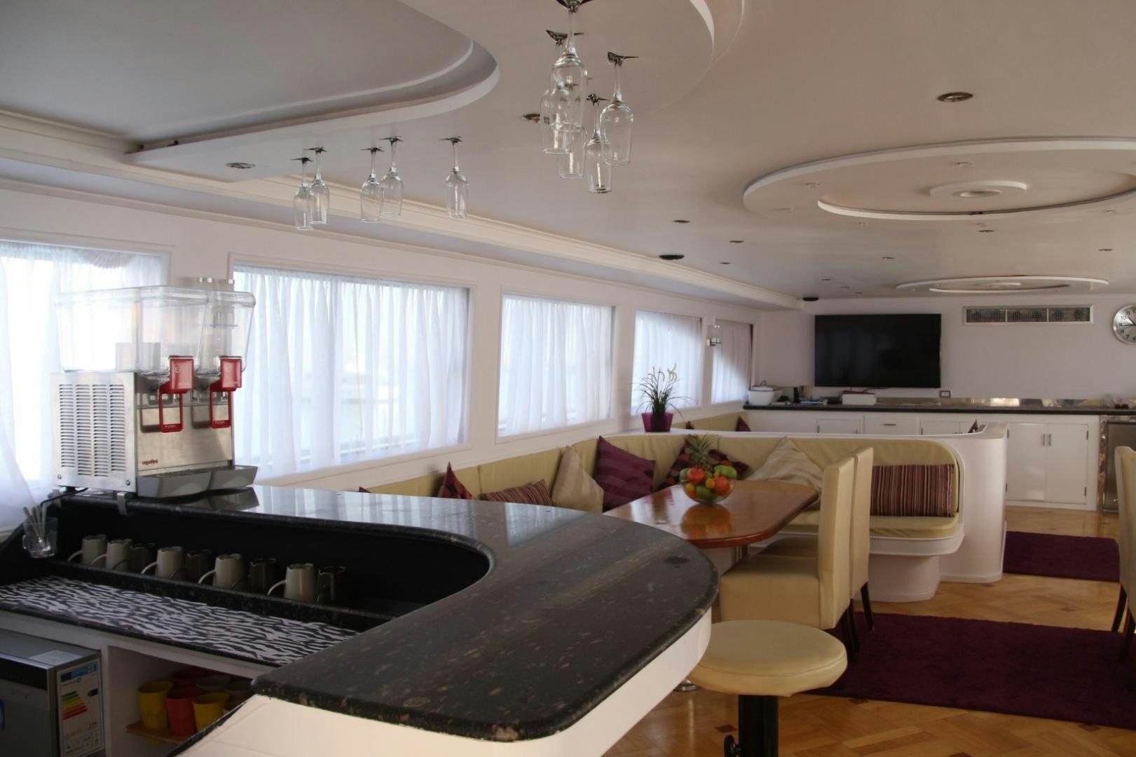 a kitchen with a large island aboard SIM SIM Yacht for Sale