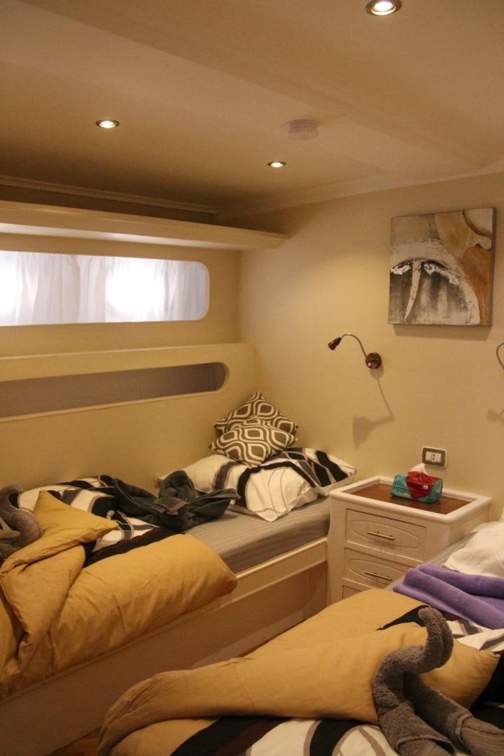 a couple of beds in a room aboard SIM SIM Yacht for Sale