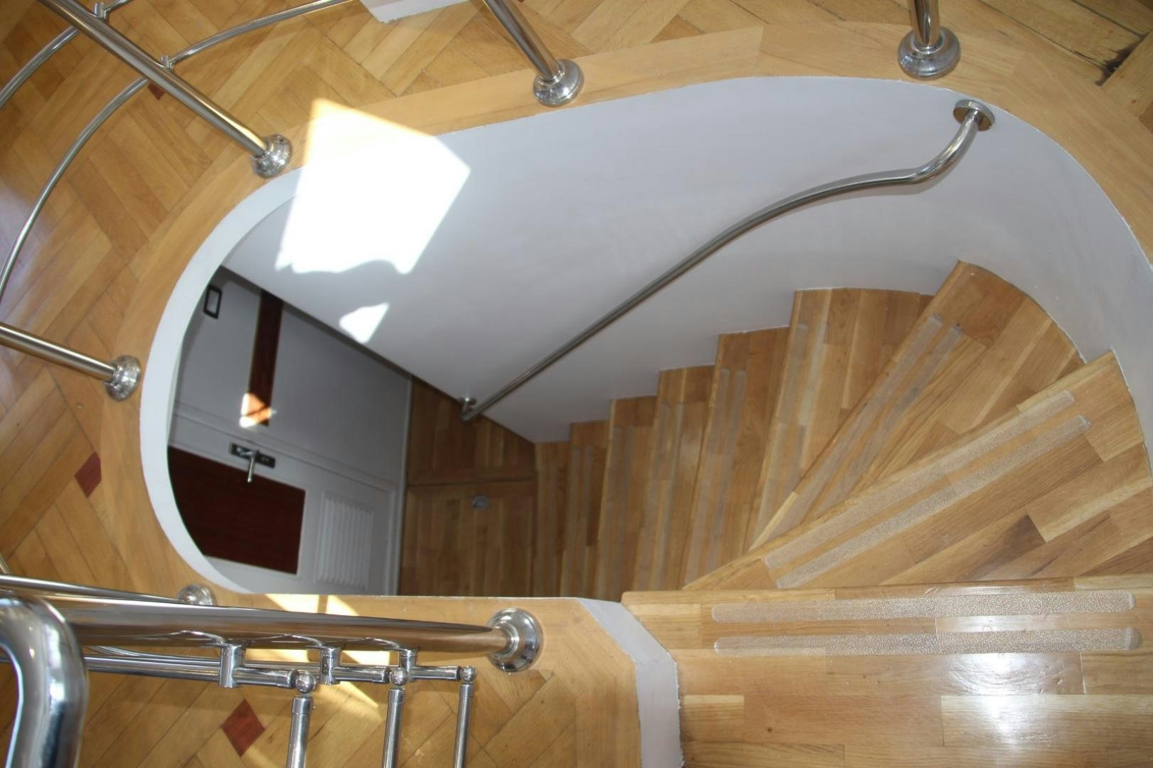 a white fan on a wooden table aboard SIM SIM Yacht for Sale