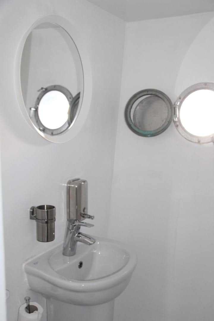 a bathroom with two mirrors aboard SIM SIM Yacht for Sale