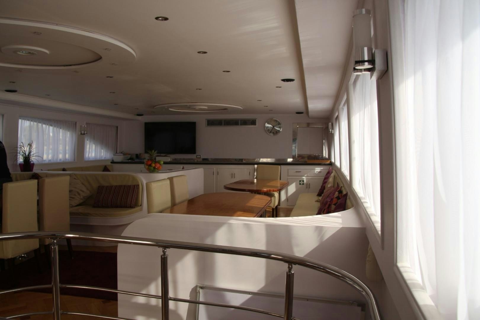 a kitchen with white cabinets aboard SIM SIM Yacht for Sale