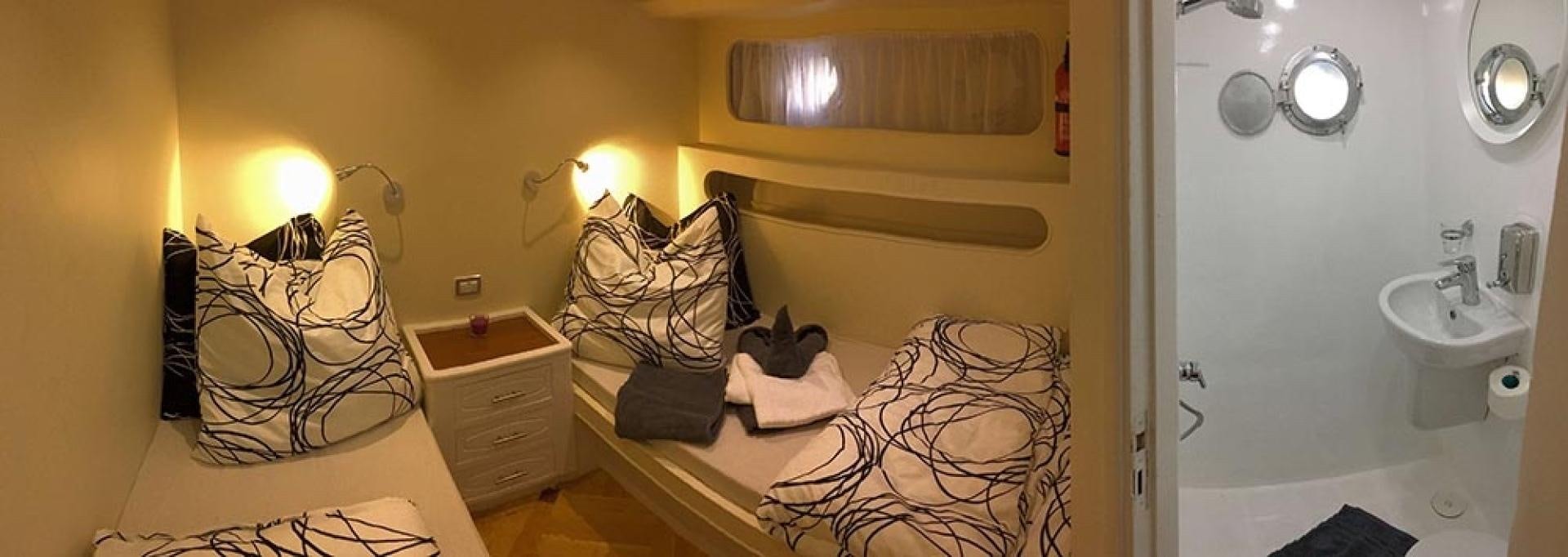 a bathroom with a towel and a sink aboard SIM SIM Yacht for Sale