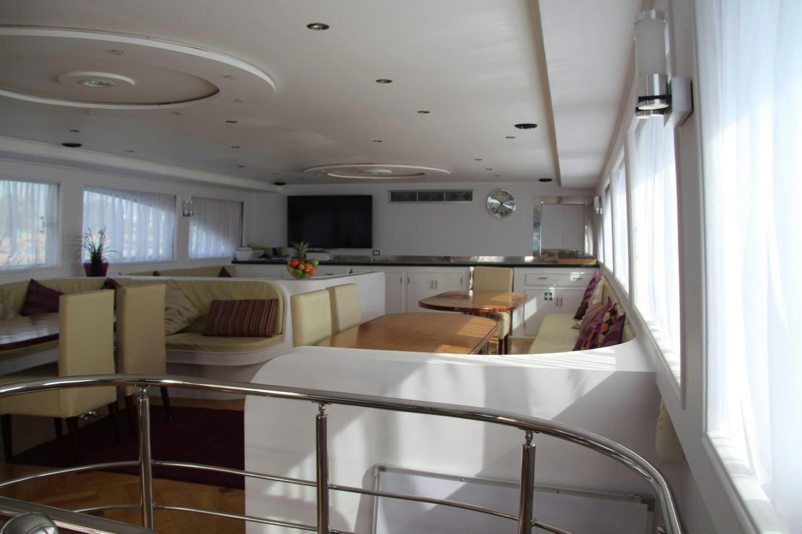 a kitchen with white cabinets aboard SIM SIM Yacht for Sale