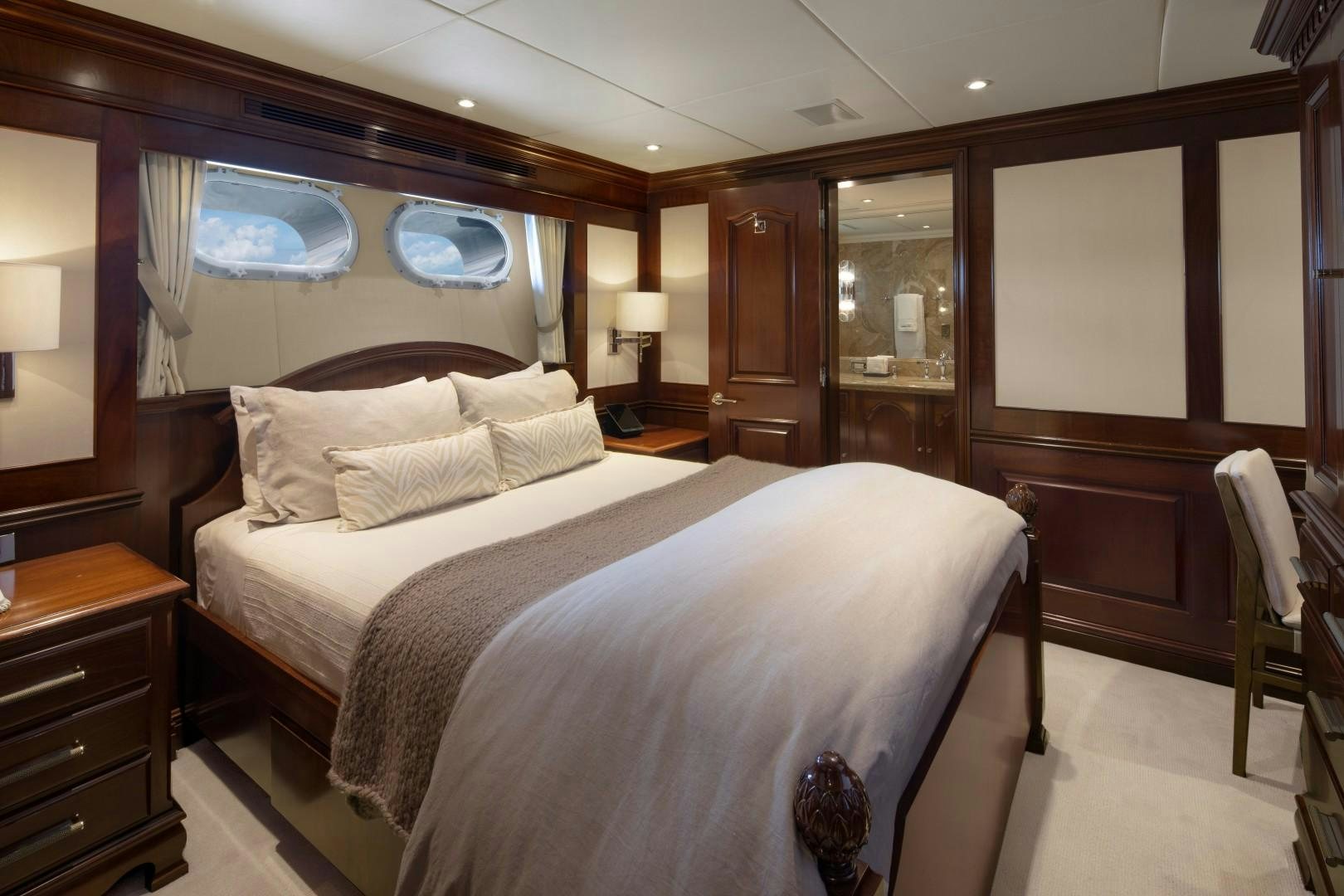 a bedroom with a large bed aboard BACCHUS "NAME RESERVED" Yacht for Sale