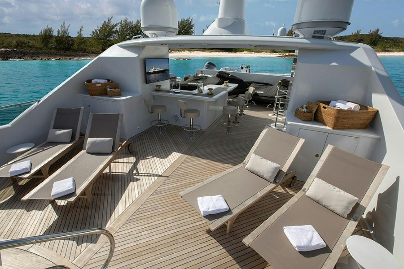 a deck with chairs and a pool aboard BACCHUS "NAME RESERVED" Yacht for Sale