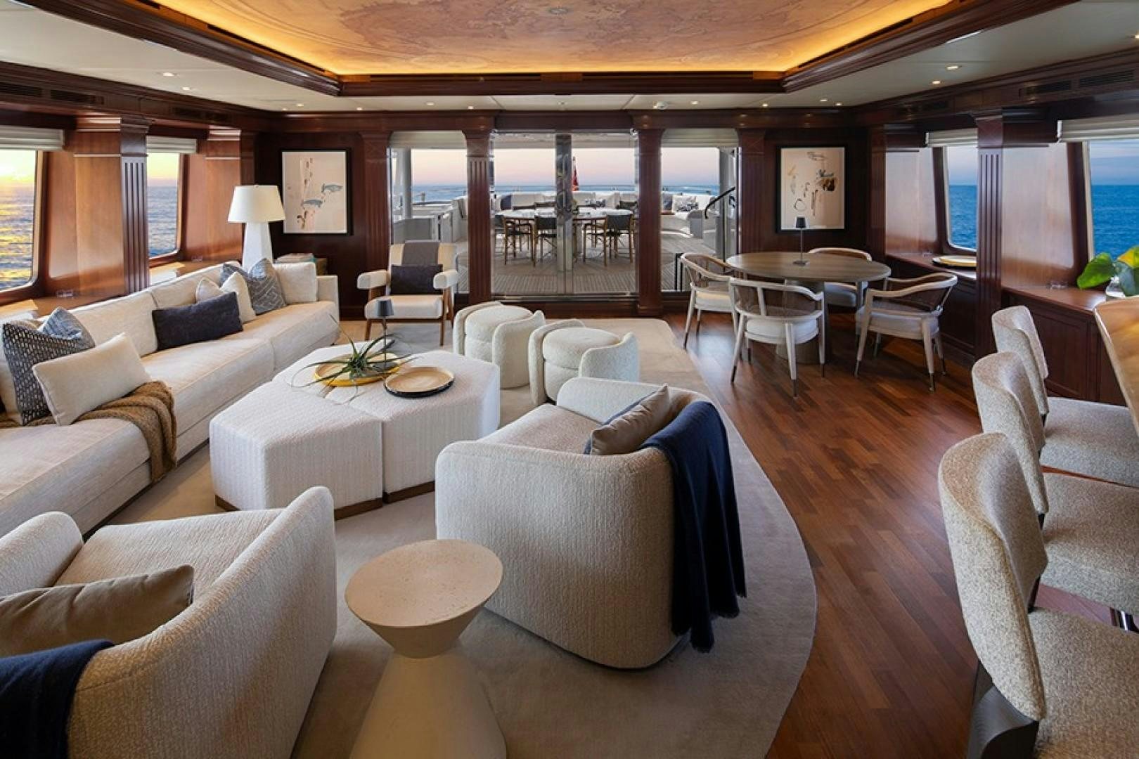 a room with a large table and chairs aboard BACCHUS "NAME RESERVED" Yacht for Sale