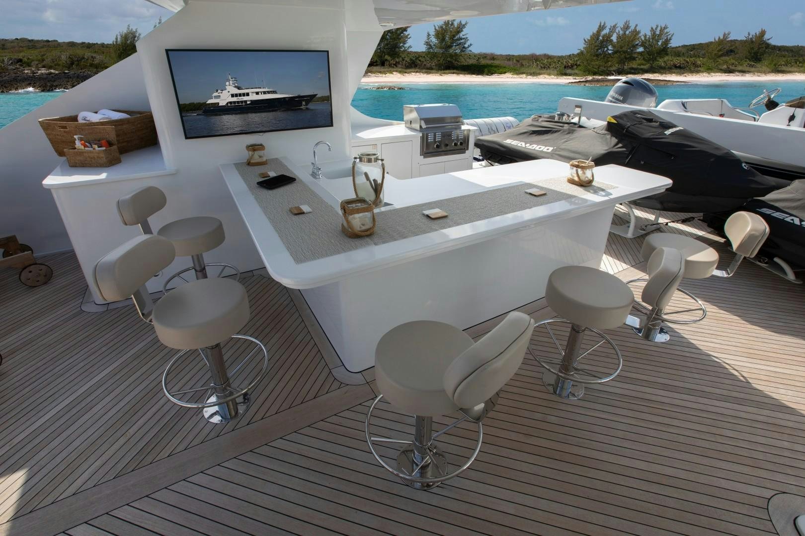 a white table with chairs on it aboard BACCHUS "NAME RESERVED" Yacht for Sale