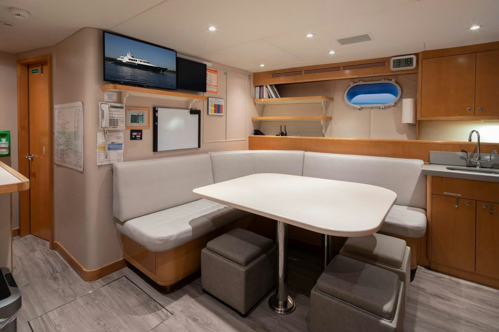 a room with a table and chairs aboard BACCHUS "NAME RESERVED" Yacht for Sale