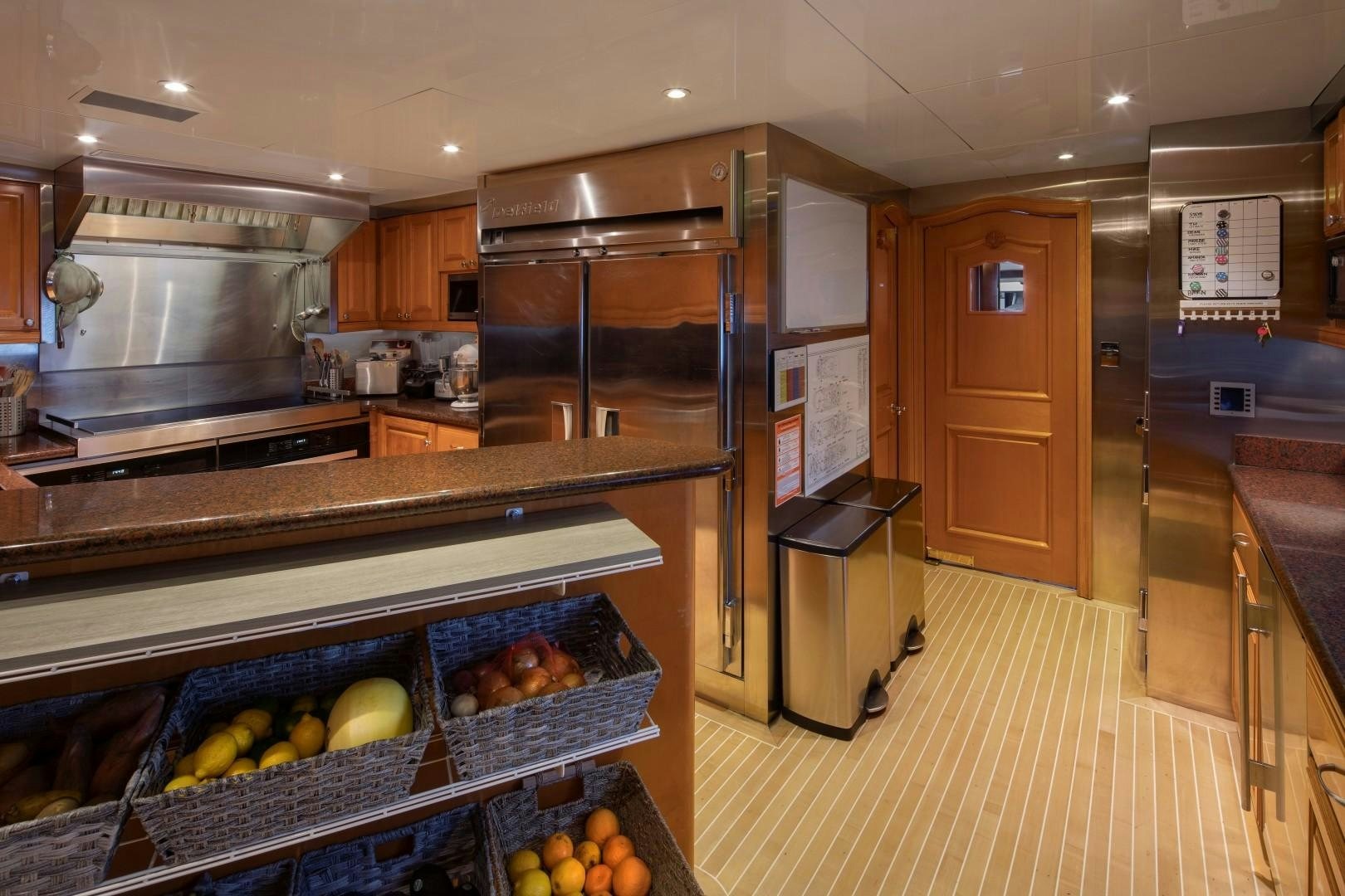 a kitchen with a large refrigerator aboard BACCHUS "NAME RESERVED" Yacht for Sale