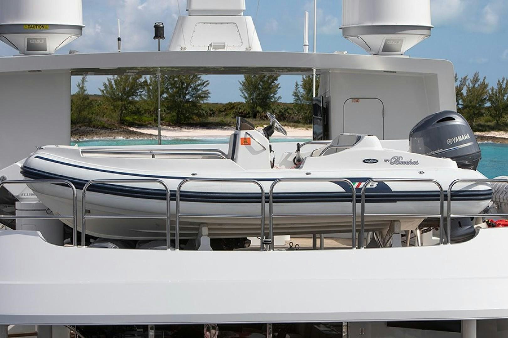 a white boat on a dock aboard BACCHUS "NAME RESERVED" Yacht for Sale