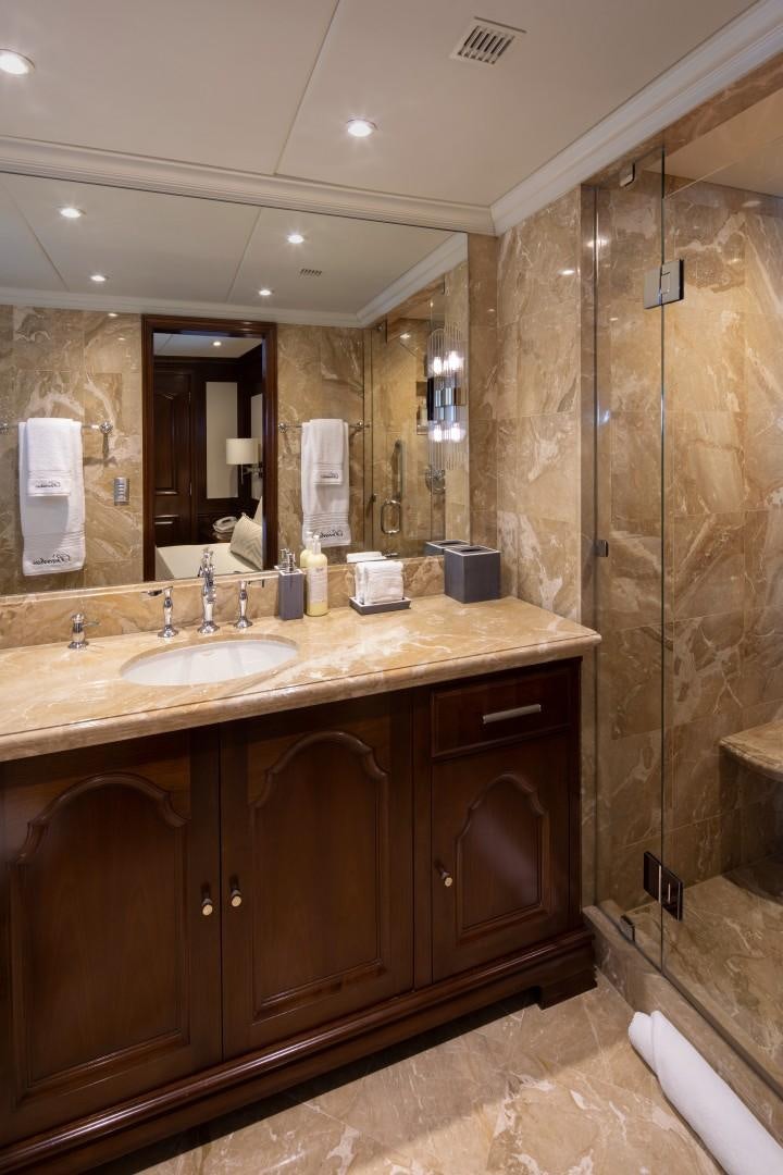 a bathroom with a sink and a mirror aboard BACCHUS "NAME RESERVED" Yacht for Sale