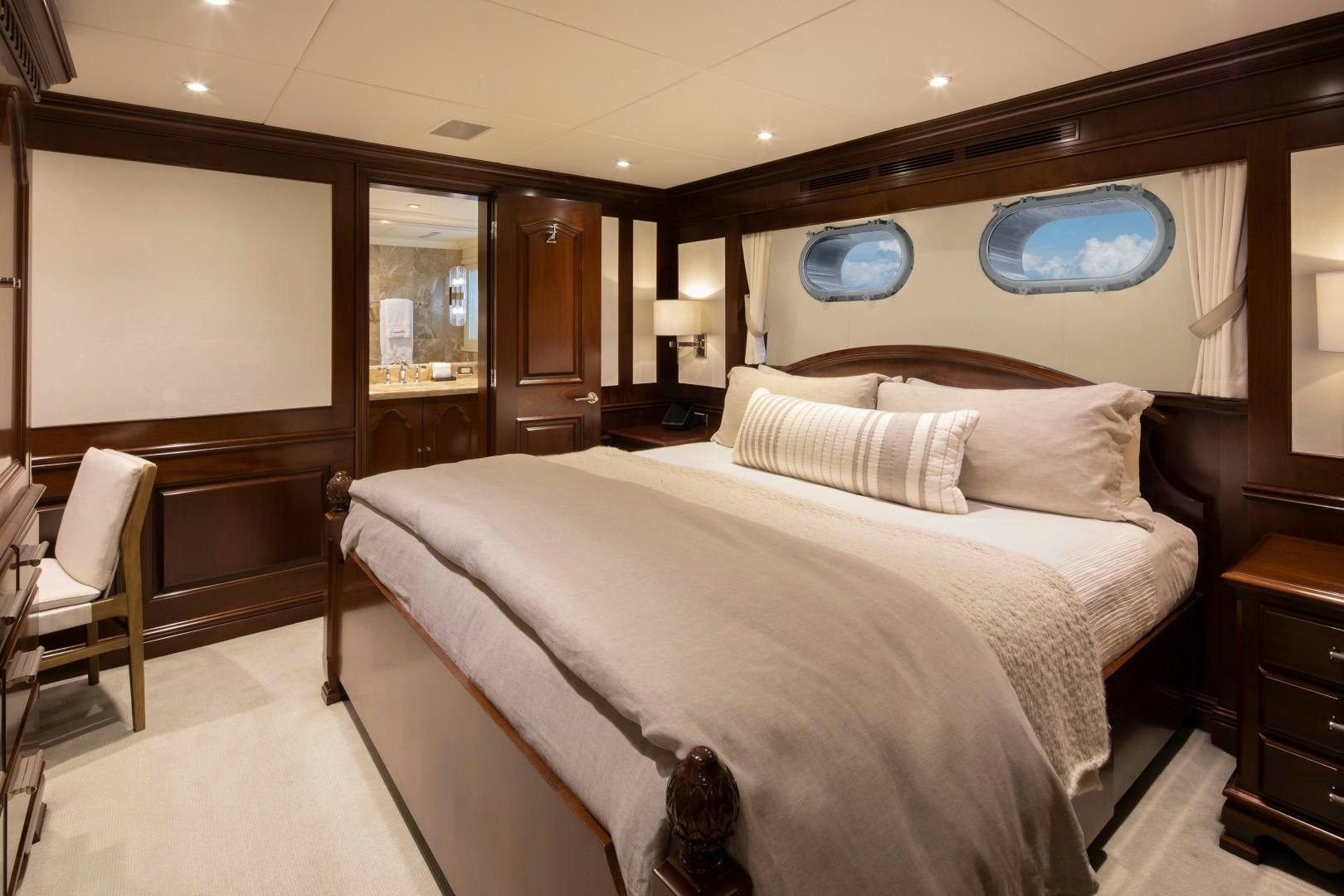 a large bed in a hotel room aboard BACCHUS "NAME RESERVED" Yacht for Sale