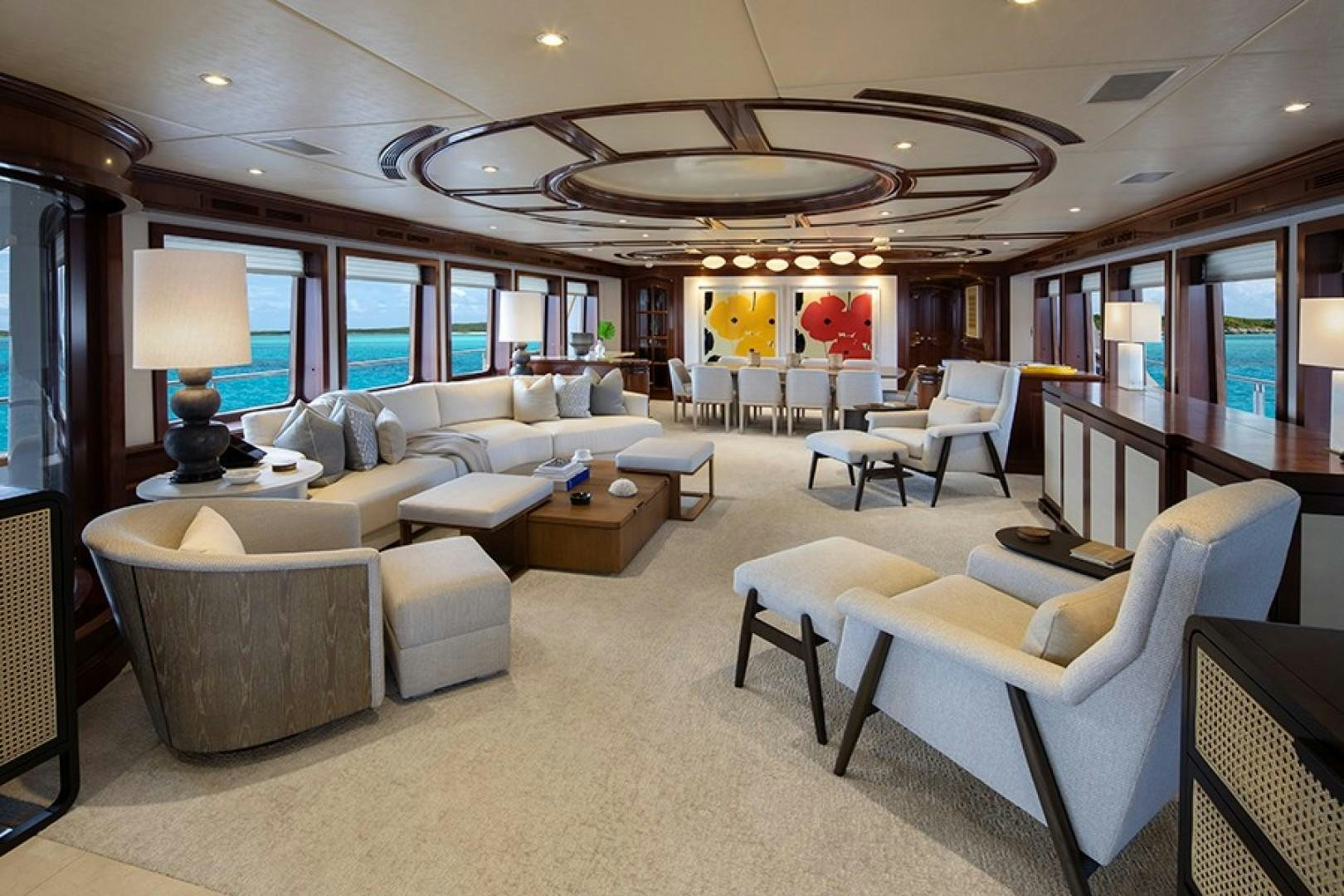 a living room with a large chandelier aboard BACCHUS "NAME RESERVED" Yacht for Sale