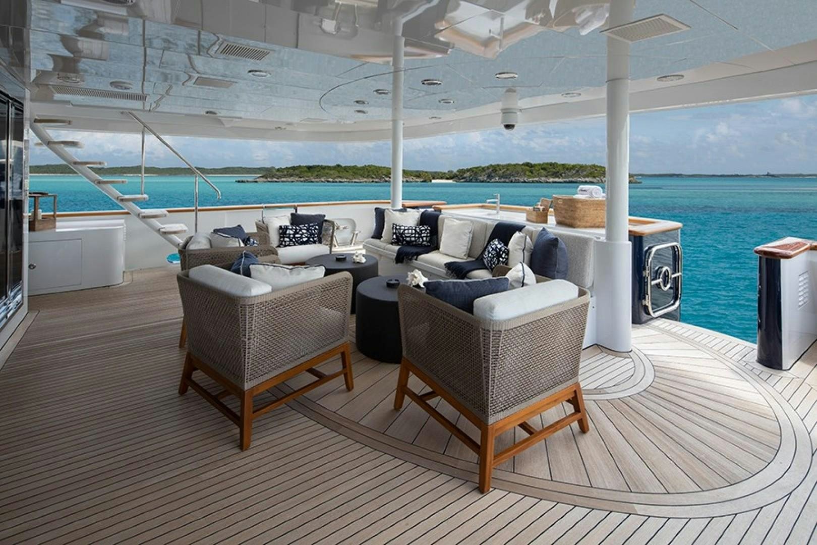 a room with a couch and a table and chairs aboard BACCHUS "NAME RESERVED" Yacht for Sale