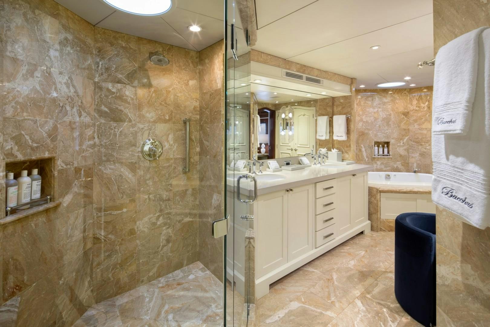 a bathroom with a large stone wall aboard BACCHUS "NAME RESERVED" Yacht for Sale