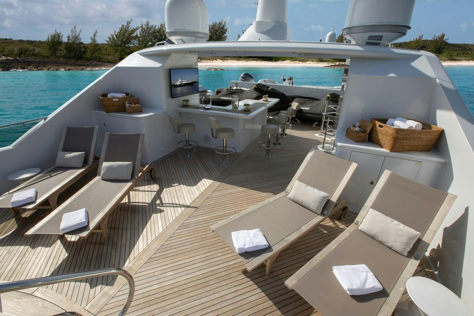a deck with chairs and tables on it by a pool aboard BACCHUS "NAME RESERVED" Yacht for Sale