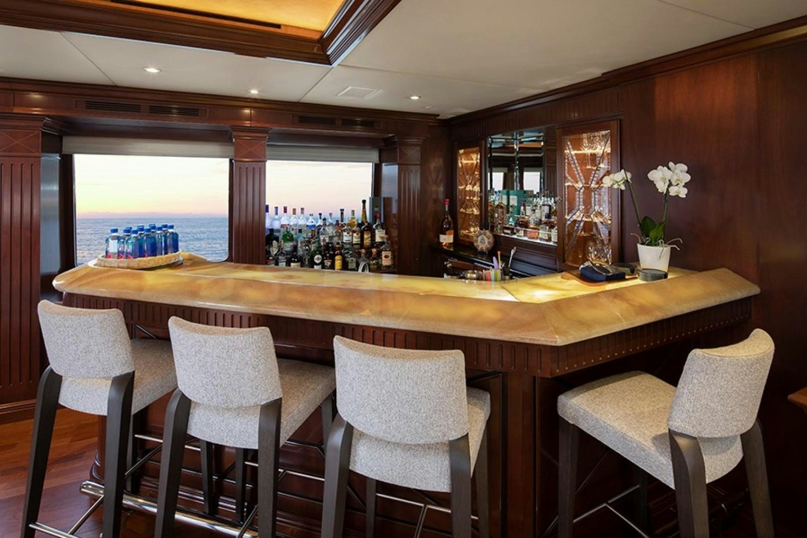 a bar with a table and chairs aboard BACCHUS "NAME RESERVED" Yacht for Sale
