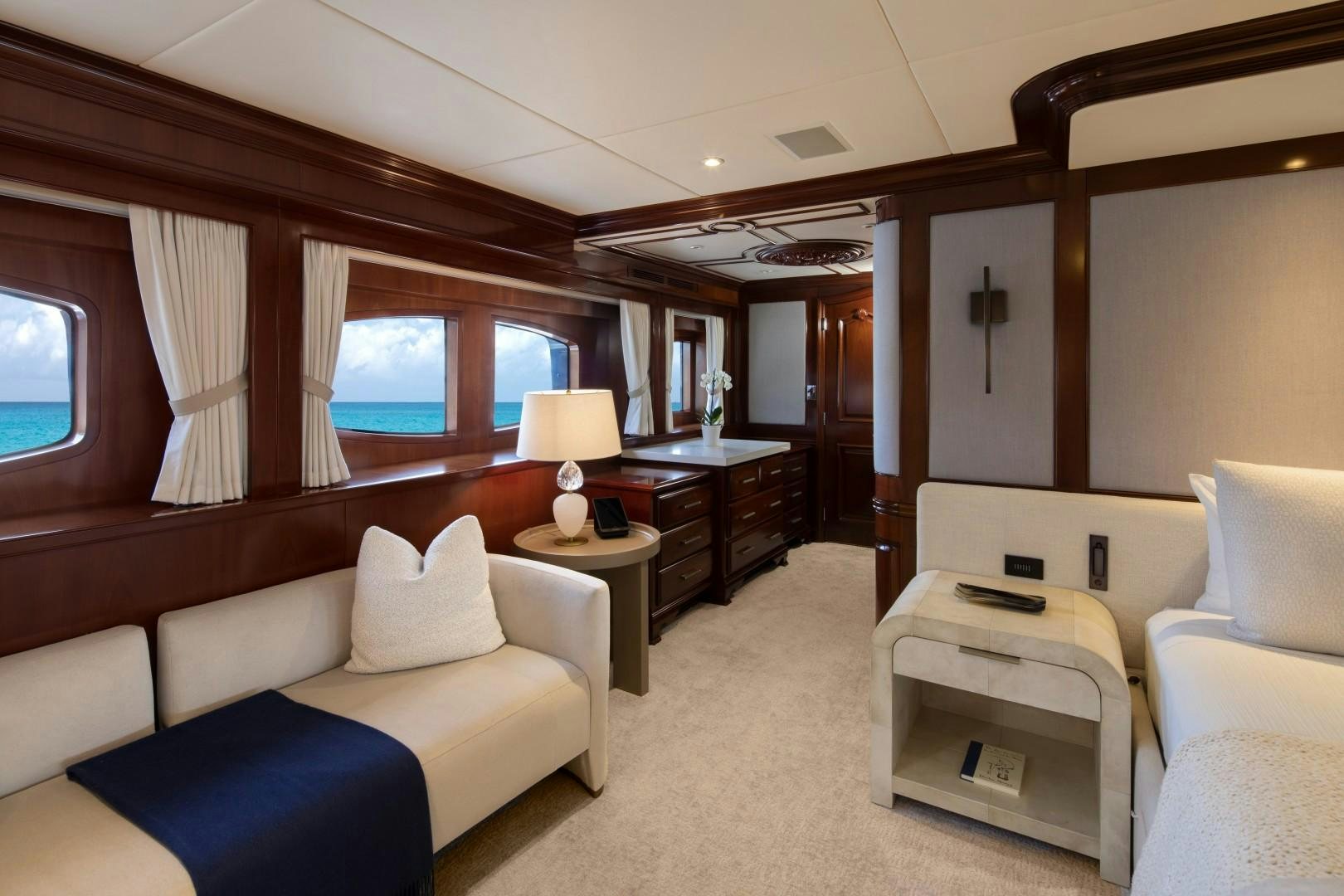 a living room with a couch and a table aboard BACCHUS "NAME RESERVED" Yacht for Sale