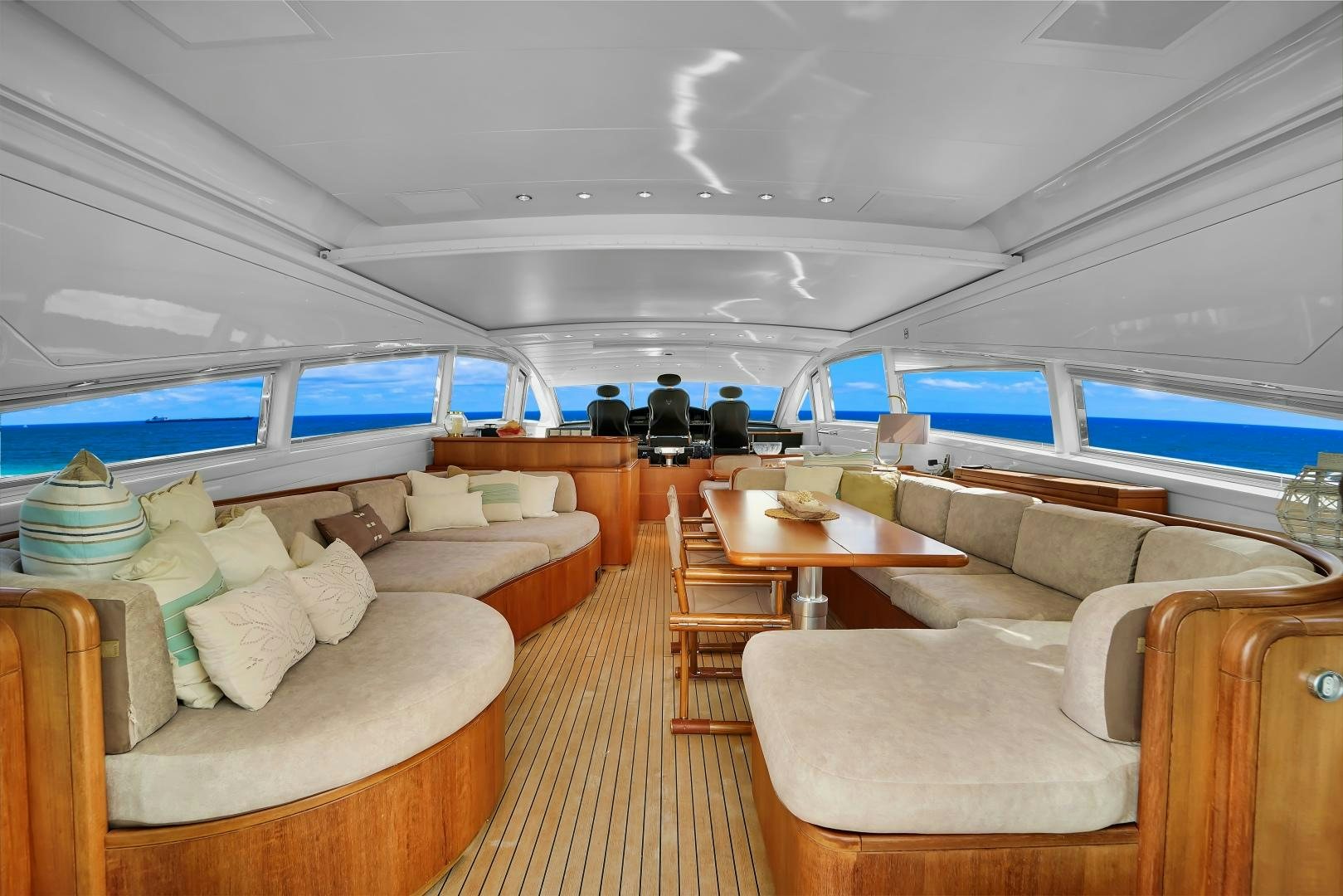 a large room with couches and a table aboard CHURRI Yacht for Sale