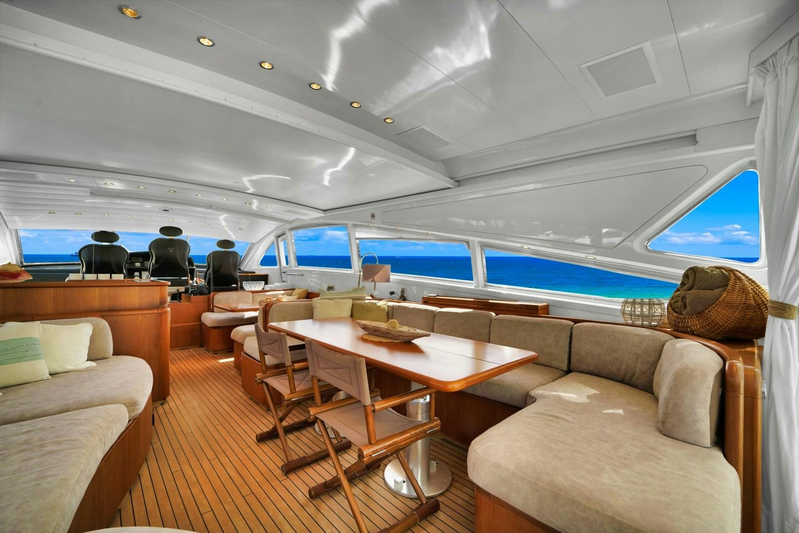 a room with a couch and a table and chairs aboard CHURRI Yacht for Sale